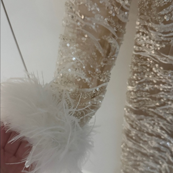 Elegant White Lace Jumpsuit with Feather Accents - Picture 9 of 9